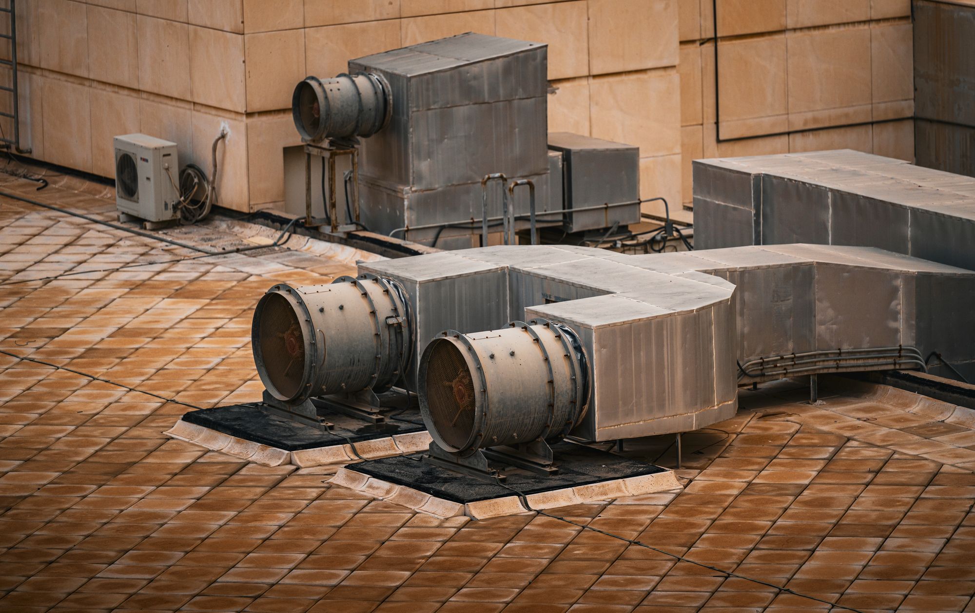 Commercial HVAC and refrigeration units on a building rooftop